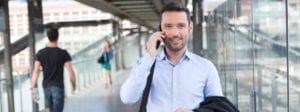 Professional Man on mobile in public space | The Career Academy Ireland